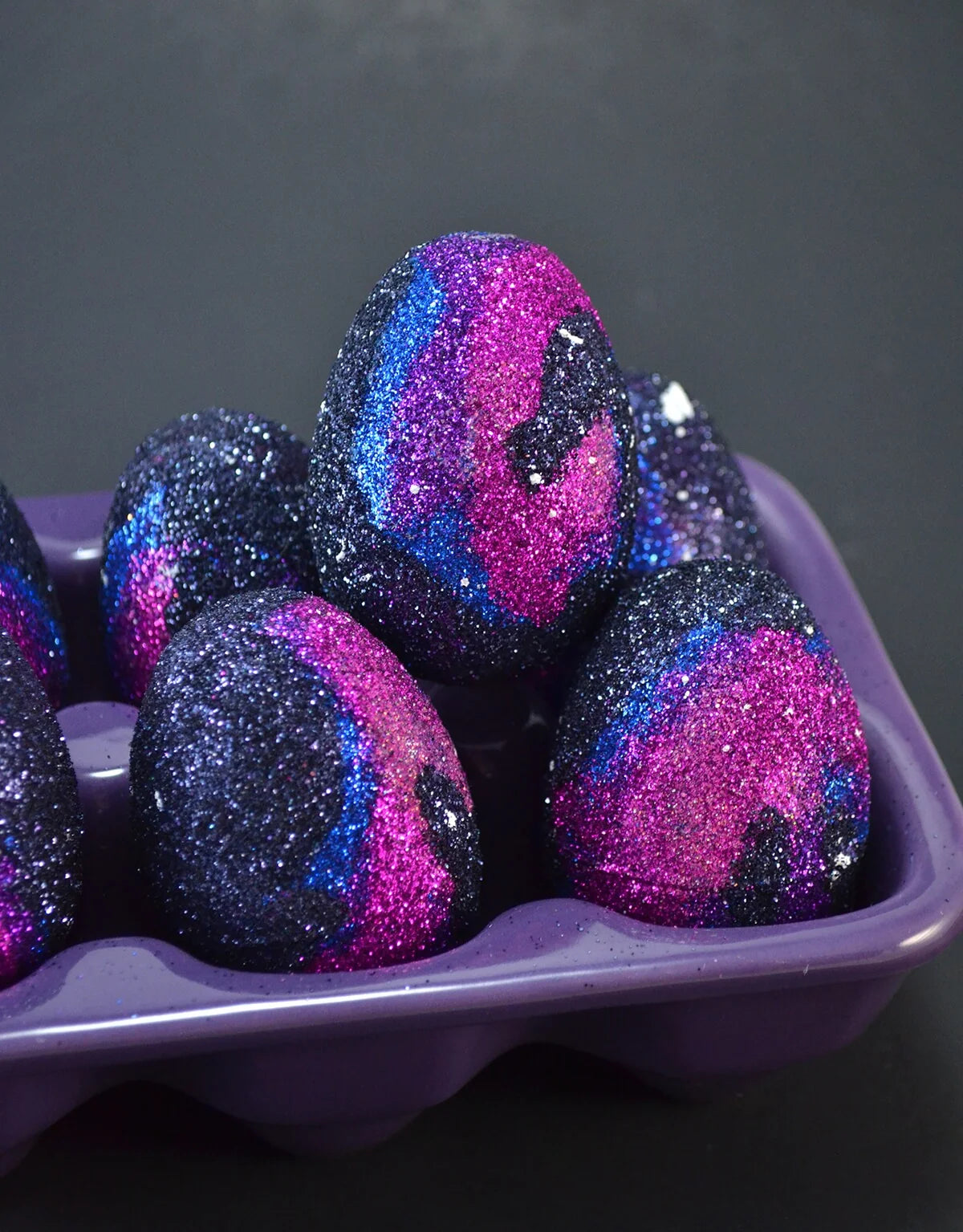 https://aleenes.com/cdn/shop/articles/0002251_how-to-glue-glitter-to-plastic-glitter-galaxy-eggs.webp?v=1706254824