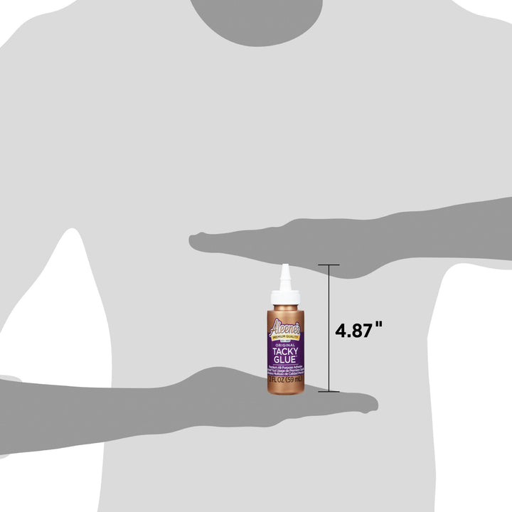 15600 Aleenes Original Tacky Glue 2 fl. oz. held for size example