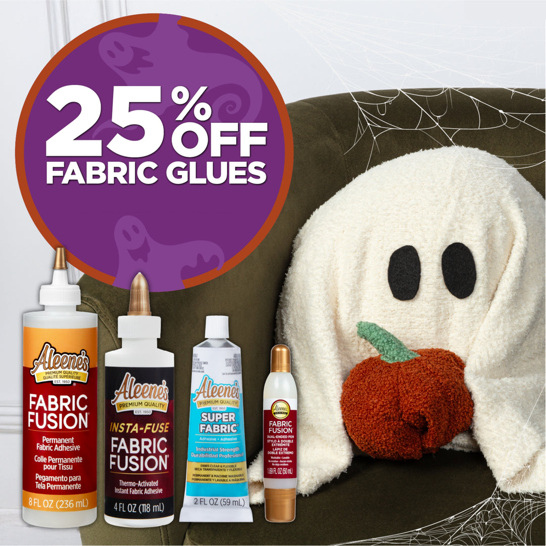 25% off Aleene’s fabric glues with Halloween-themed ghost blanket and pumpkin decor.